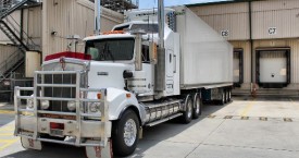 white refrigerated truck at loading dock