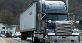 blue semi van on road
