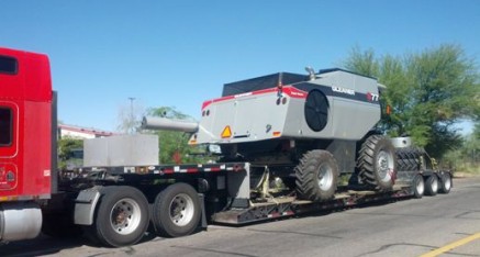 four wheel equipment vehicle on tow trailer